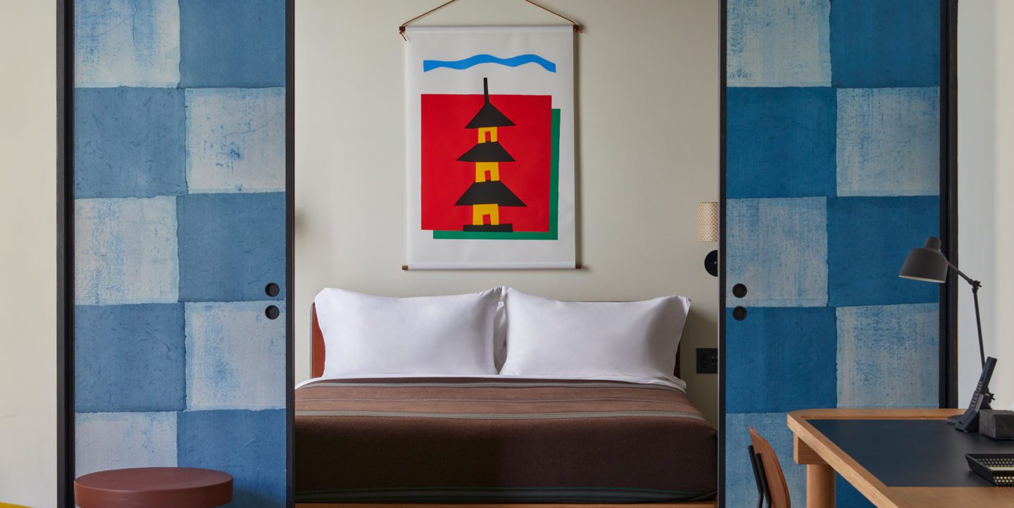 Ace Hotel Kyoto guest room with checkered shōji and indigo throws
