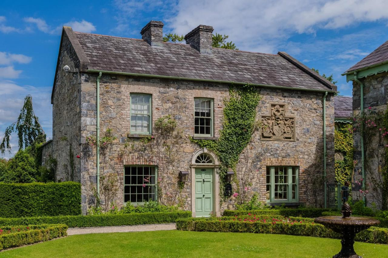 Ashford Castle ivy-covered stone manor with formal gardens, Cong, County Mayo