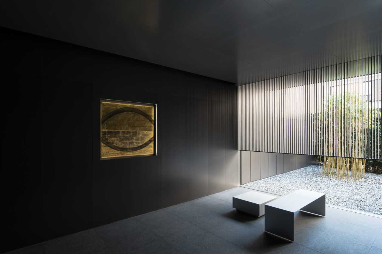 MOGANA Kyoto suite with charred cedar walls and gold disk artwork