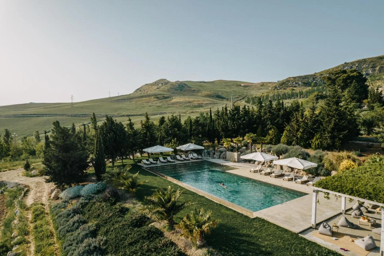 Rectangular pool at Masseria Susafa with the Madonie mountains beyond, central Sicily