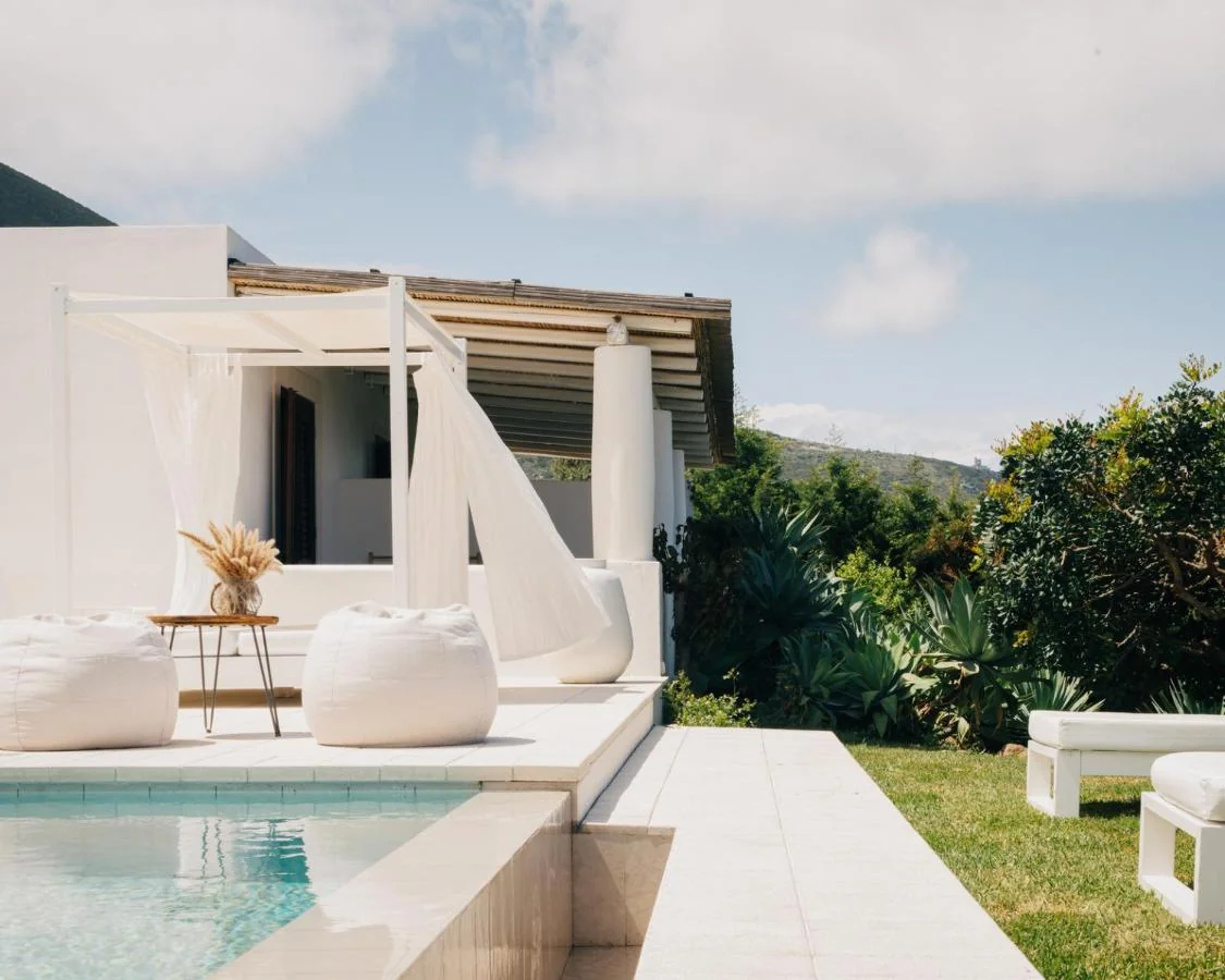 Whitewashed Hotel Principe di Salina with infinity pool overlooking the Tyrrhenian Sea on Salina, Aeolian Islands
