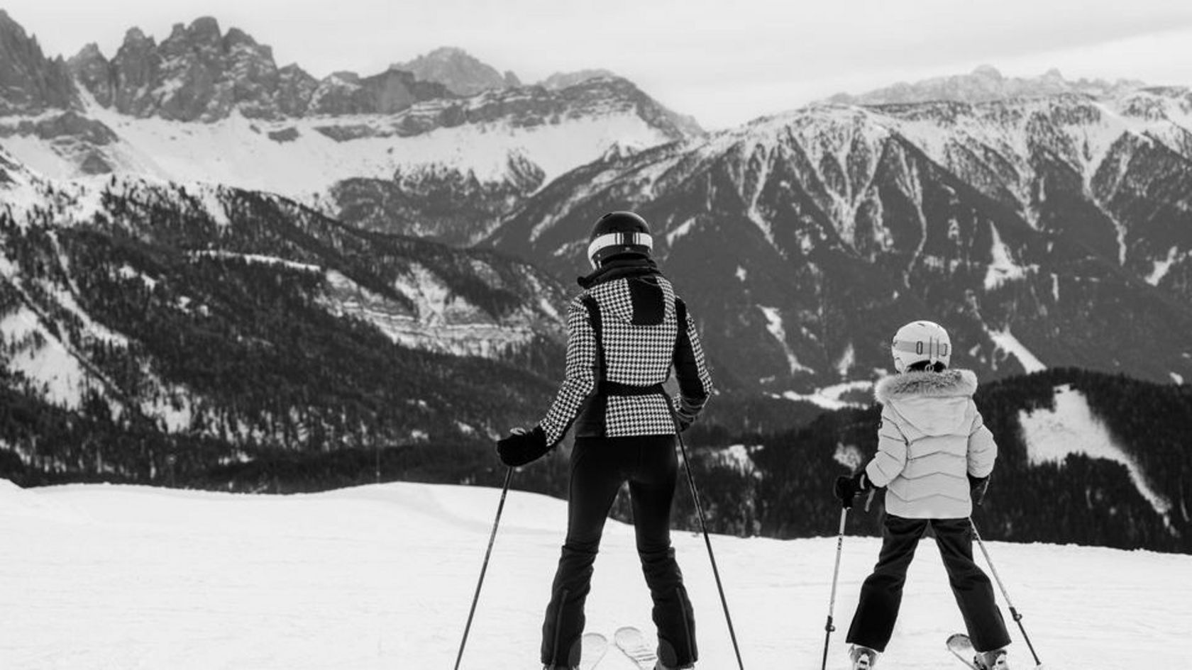 Sonnwies South Tyrol black and white photograph of mother and child skiing in the Dolomites