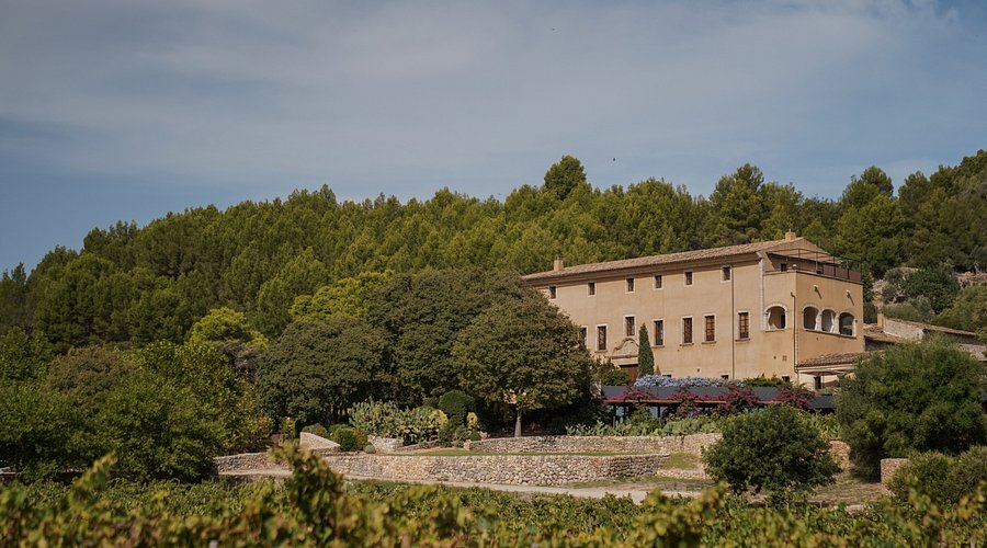 The 12th-century monastery architecture and pool of Son Brull Hotel & Spa in the Tramuntana